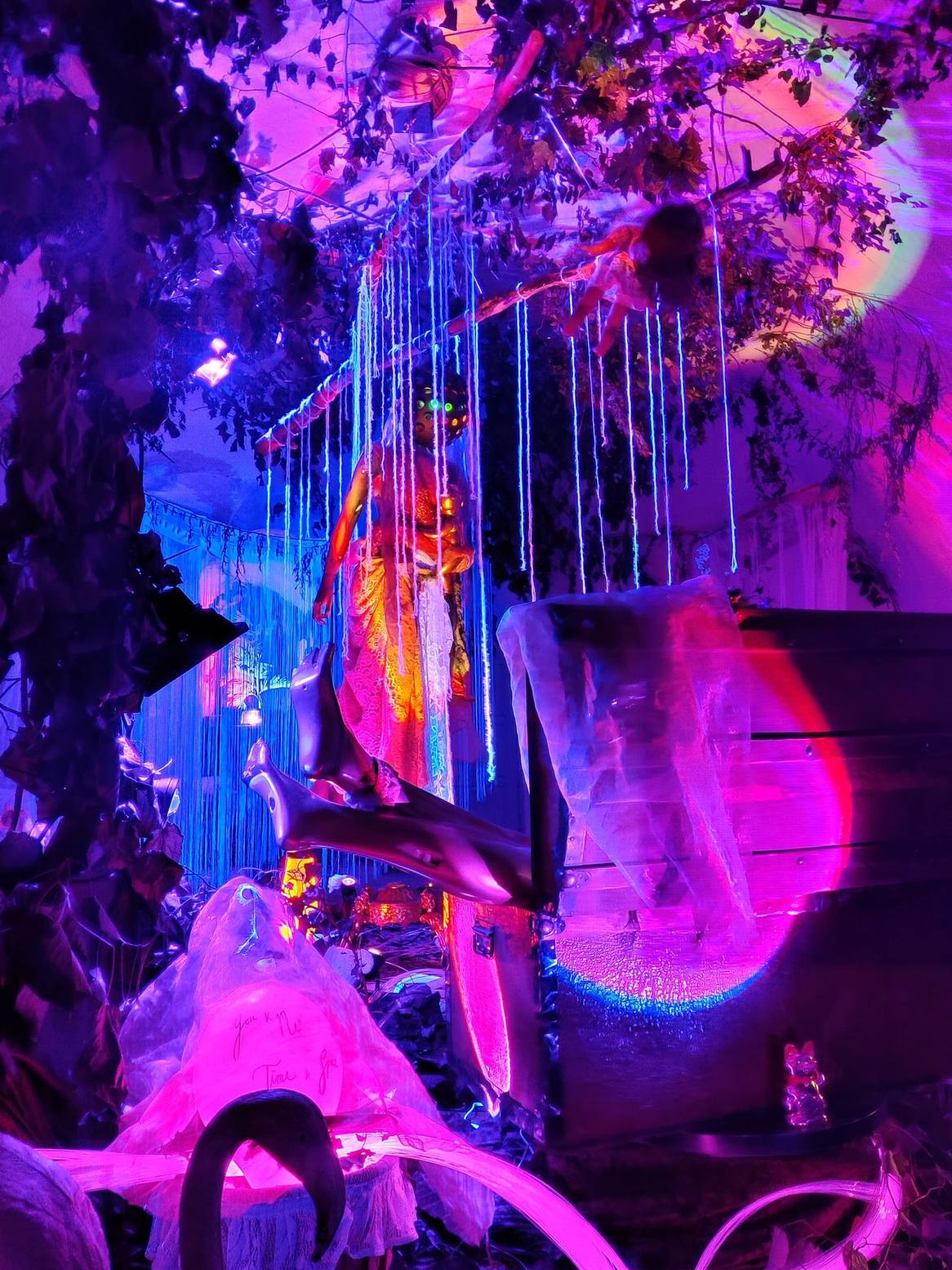 You & me, Space & Time. An immersive, surrealist children’s room centered on a female entity cradling a golden baby—a figure representing the desire for creation and the sanctity of the feminine portal.
